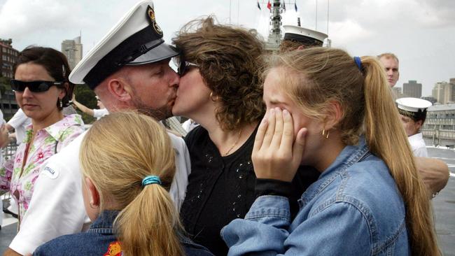 Sailor Mark Gibbs with wife Michelle and daughters Nicole and Phillipa aboard HMAS Kanimbla at Garden Island, Sydney, during farewell to troops leaving for the Middle East for involvement in a possible war against Iraq in 2003.