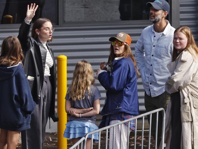 Drew Barrymore (hat and sunglasses) arrives in Sydney and heads straight to Taronga Zoo with her family.