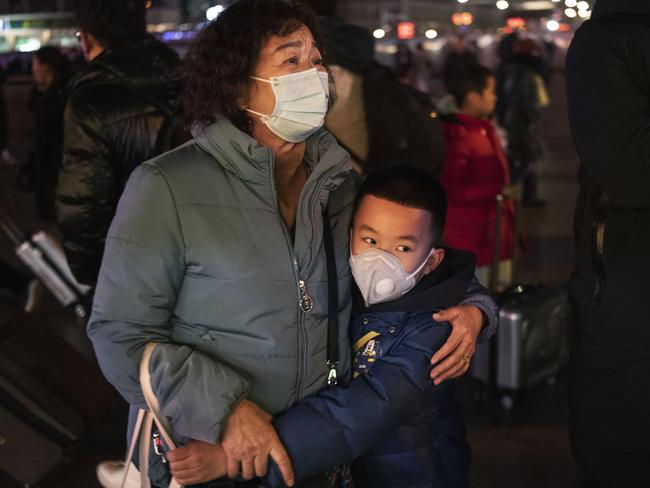 Wearing a face mask could help if the virus is transmitted through the air. Washing hands with soapy water regularly can help prevent the spread. Picture: Getty Images