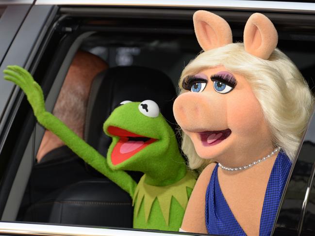 (FILES) In this March 11, 2014 file photo, Kermit the Frog and Miss Piggy arrive for the world premiere of Disney's "Muppets Most Wanted," at El Capitan Theatre in Hollywood, California.   The actor who voiced Kermit the Frog for nearly three decades is hopping mad at Disney executives for being sacked, slamming his dismissal as a "betrayal" after bringing the puppet to life for 27 years. In a stark war of words that spotlights troubled waters within the wildly popular franchise, 58-year-old Steve Whitmire gave an acerbic interview to The New York Times bitterly complaining about his dismissal.  / AFP PHOTO / ROBYN BECK