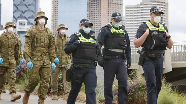 ADF and police patrol along the Yarra in Melbourne on day one of mandatory mask wearing in Melbourne. Picture: NCA NewsWire / David Crosling