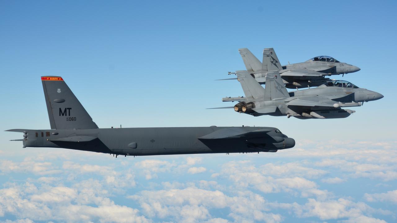 A Royal Australian Air Force No. 6 Squadron EA-18G Growler aircraft and a No. 1 Squadron F/A-18F Super Hornet aircraft fly alongside a United States Air Force B-52H Stratofortress aircraft during Exercise Talisman Sabre 2021. Picture: Department of Defence