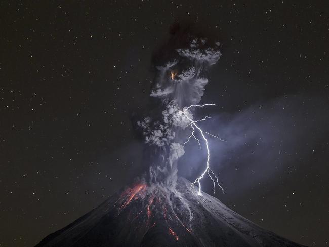 The power of naturePowerful eruption of Colima Volcano in Mexico on December 13th, 2015. That night, theweather was dry and cold, friction of ash particles generated a big lightning of about 600meters that connected ash and volcano, and illuminated most of the dark scene. On last part of2015, this volcano showed a lot of eruptive activity with ash explosions that raised 2-3 kmabove the crater. Most of night explosions produced incandescent rock falls and lightning notbigger than 100 meters in average.Picture: Sergio Tapiro Velasco / National Geographic Travel Photographer of the Year