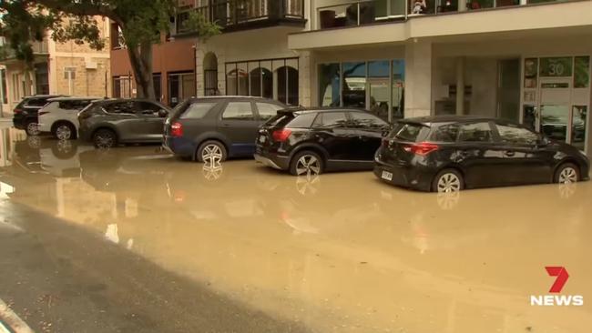 The foyer and lift of an apartment building were flooded and the ground floor of three businesses. Picture: 7 NEWS