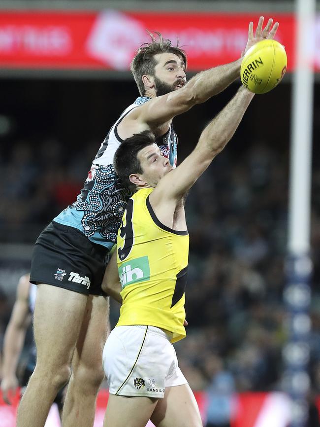 Port Adelaide’s Justin Westhoff and Richmond’s Trent Cotchin contest the ruck. Picture: Sarah Reed