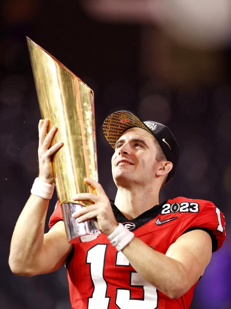 Stetson Bennett holds the trophy. Photo by Steph Chambers/Getty Images