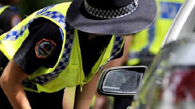 Two people were taken to a health clinic after a rollover in Central Australia and police are searching for a third man.