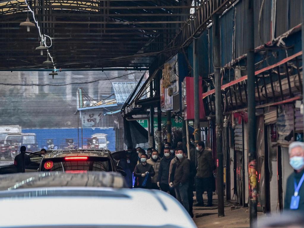 The World Health Organisation (WHO) team arrives at the closed Huanan Seafood wholesale market in Wuhan, China's central Hubei province on January 31. Picture: Hector Retamal / AFP