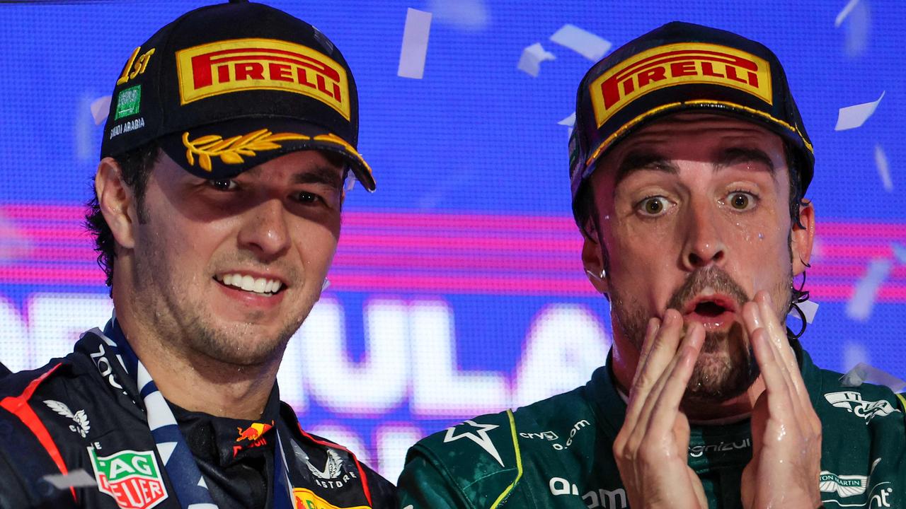 Fernando Alonso (right) on the podium with race winner Sergio Perez. Picture: AFP