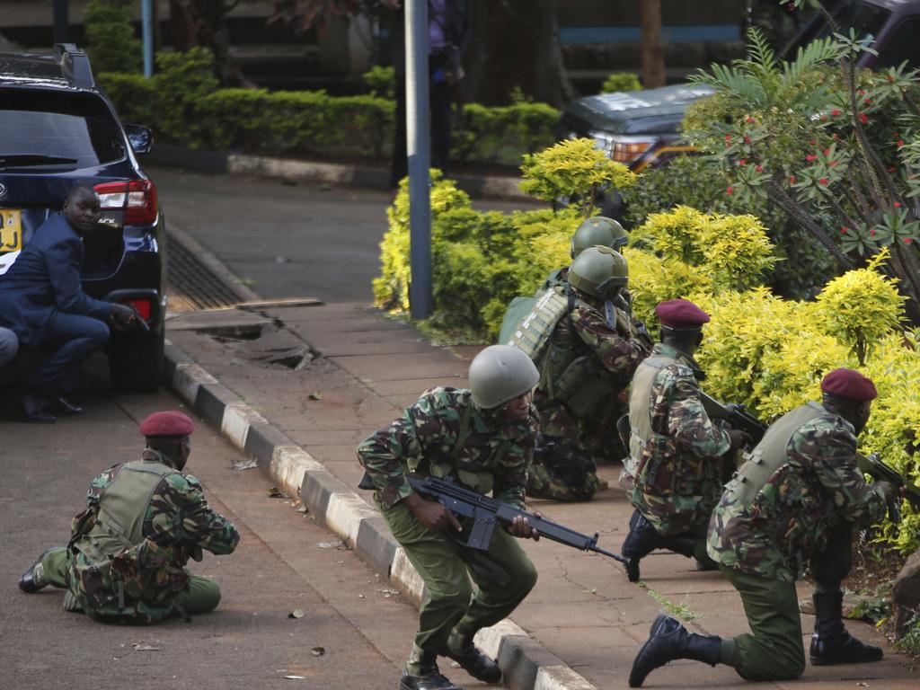 Kenyan armed forces and civilian people take cover after the attack. Picture: AP