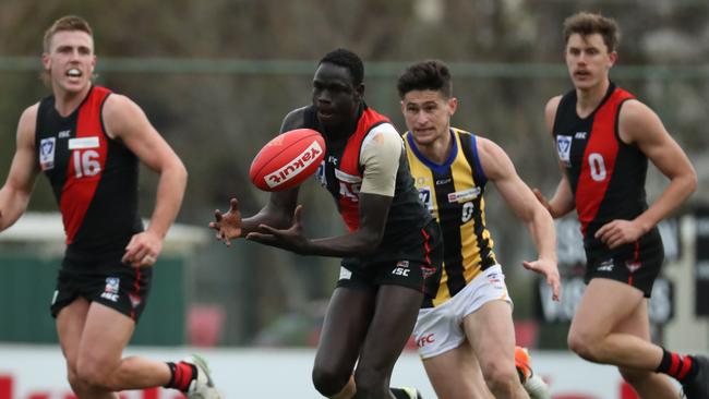 Thomas Jok gathers possession for Essendon’s VFL team. Picture: Jonathan DiMaggio/AFL Photos via Getty Images.