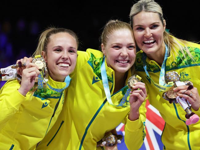 BIRMINGHAM, ENGLAND - AUGUST 07: Paige Hadley, Kate Moloney and Gretel Bueta of Team Australia pose for a photo during the Netball Medal Ceremony on day ten of the Birmingham 2022 Commonwealth Games at NEC Arena on August 07, 2022 on the Birmingham, England. (Photo by Stephen Pond/Getty Images)