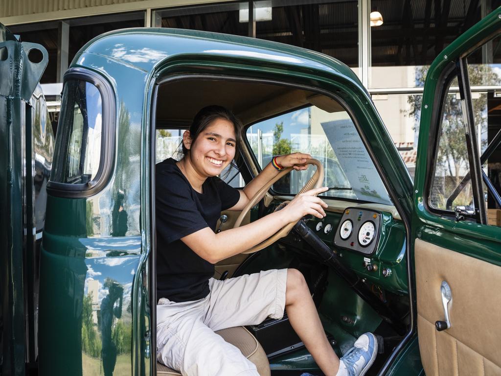 Victoria Ramos sits in the JJ Richards replica Bedford that operated in Toowoomba in 1962 at the expo. Picture: Kevin Farmer