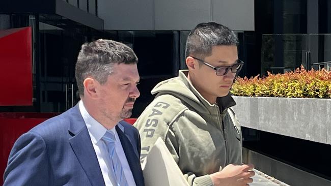 Wei Wang (right) leaves ACT Law Courts with his lawyer Michael Kukulies-Smith on January 11. Picture: Julia Kanapathippillai