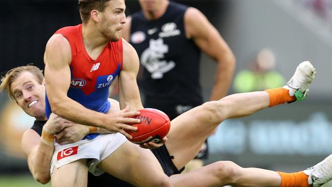 Nick Graham tackles Melbourne's Jack Viney during his time at Carlton. Pic: Michael Klein