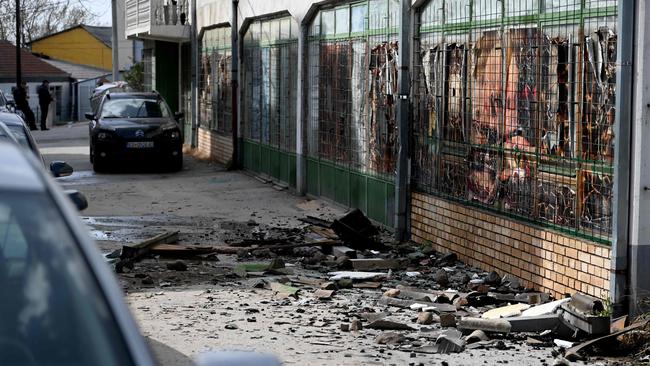 Debris lies on the pavement outside the burnt down nightclub. Picture: Stringer / AFP