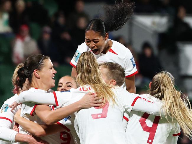 Canada players celebrate scoring their second goal during the Australia and New Zealand 2023 Women's World Cup Group B football match between Canada and Ireland at Perth Rectangular Stadium in Perth on July 26, 2023. (Photo by Colin MURTY / AFP)