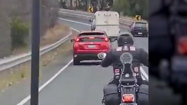 A ‘selfish’ driver has been caught on camera crossing double white lines on a blind corner to overtake two cars and a horse float in Strathalbyn. Picture: 7NEWS