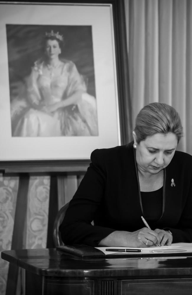 Premier Anastacia Palaszcuk shared this photo of her signing The Queen's condolence book and of her visit to the Queen Elizabeth II statue this morning where she laid a wreath with Governor Dr Jeannette Young.