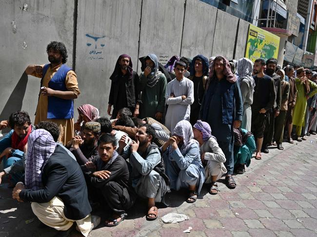 People in a queue outside a bank to withdraw money in Kabul. Picture: AFP