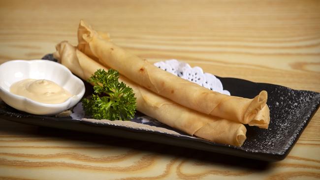 Hometown Secret’s delicious Garlic Prawn Spring Rolls are filled with chunks of garlicky prawns and wrapped in shatteringly crisp pastry. Picture: Chris Kidd