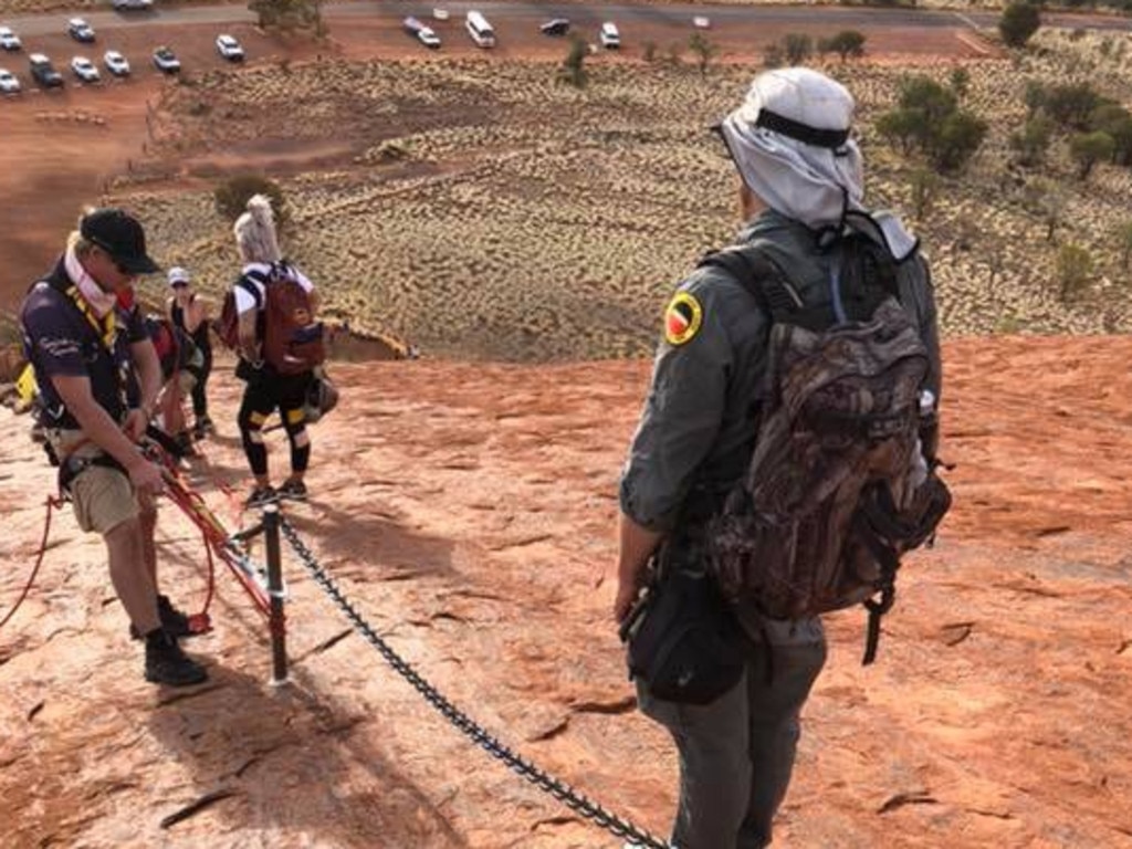 Uluṟu-Kata Tjuṯa National Park Park rangers atop Uluru, after a man in his mid sixties had a heart attack on the landmark.