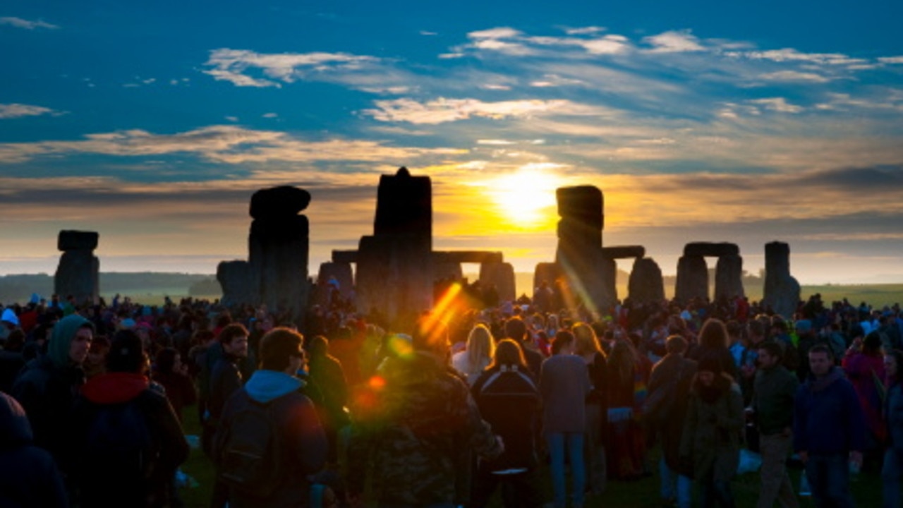 Sunrise during summer solstice celebrations at Stonehenge.