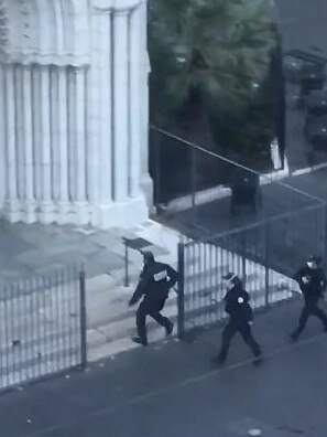 Police enter a church in Nice, France where a man stabbed three people to death. Picture: Supplied