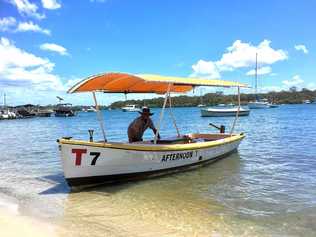 GOOD VIBRATIONS: Andrew Hosking with his restored T Boat on Noosa River.