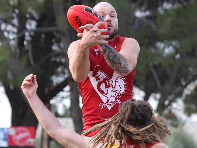 Caleb Edmead leaps for a big mark. Picture: Two Wells Football Club