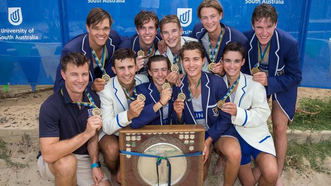 Former Olympic rower and St Peter’s College first VIII coach James McRae with this year’s head of the river winners. Picture supplied by St Peter’s College.