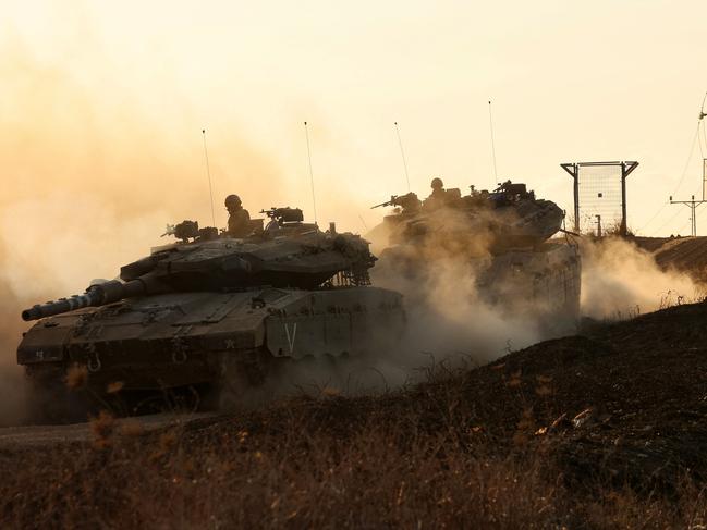 Israeli tanks move in an undisclosed location along the border with the Gaza Strip on October 18, 2023. Picture: AFP.