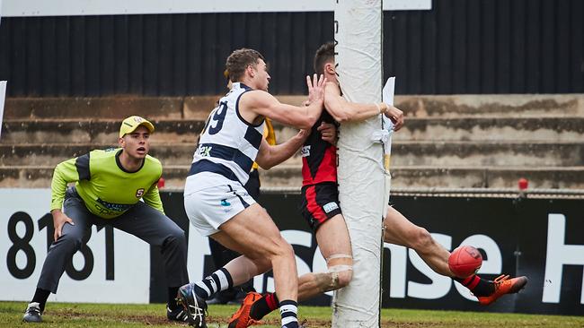 West Adelaide defender Pat Levicki takes on the post under pressure from Alex Cailotto at Richmond Oval. Picture: Matt Loxton