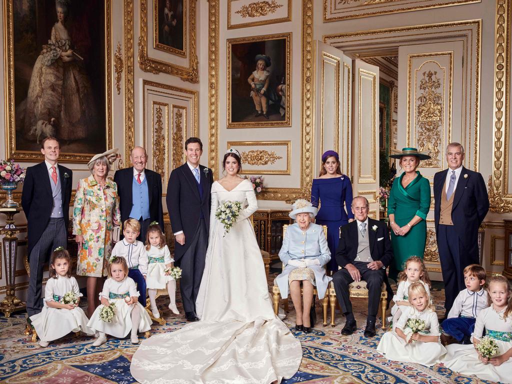 This picture shows something that would have been unthinkable two decades earlier — Fergie and Philip next to each other and smiling about it. Picture: Alex BRAMALL / BUCKINGHAM PALACE / AFP