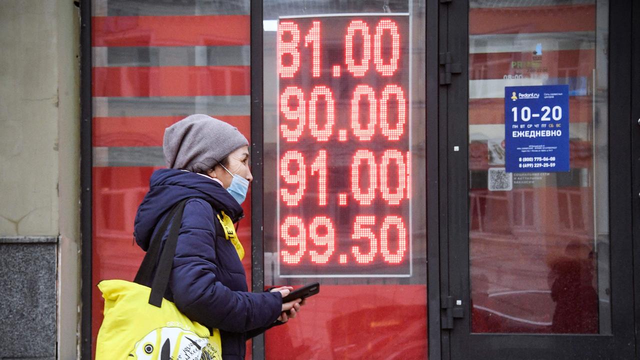 A woman walks past a currency exchange office in central Moscow on February 24, 2022. Picture: Alexander Nemenov/AFP