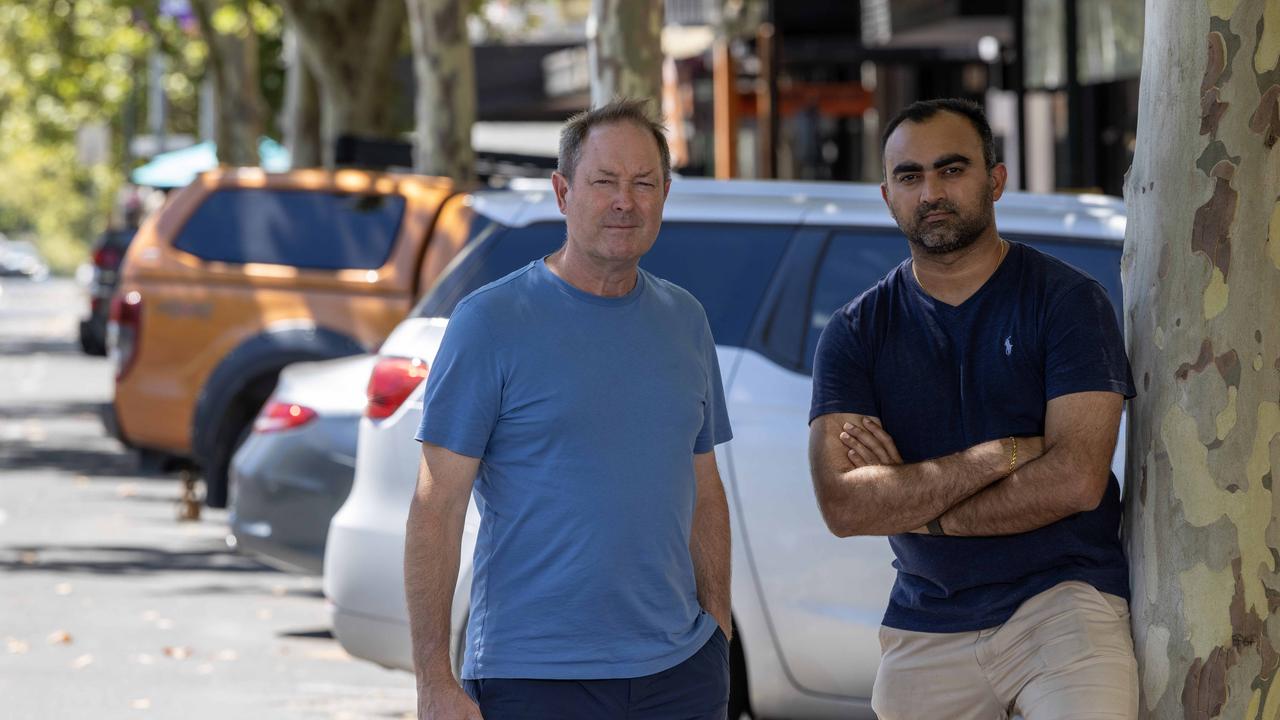 Hobo Menswear owner Ivan Deed and Coffylosophy owner Harsha Mehta are opposed to Adelaide City Council’s proposal to reduce car spaces on Hutt St. Picture: Kelly Barnes