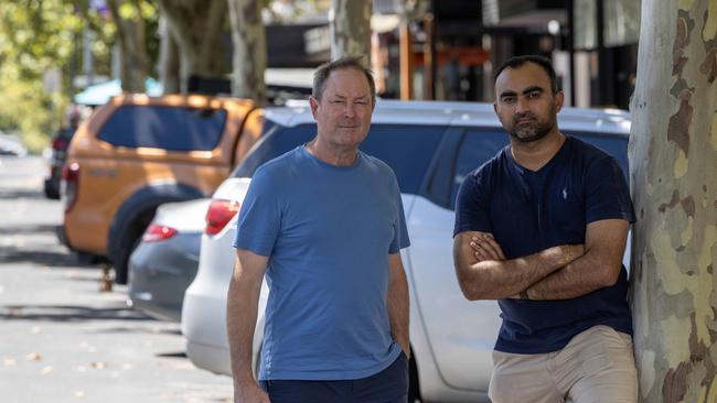 Hobo Menswear owner Ivan Deed and Coffylosophy owner Harsha Mehta are opposed to Adelaide City Council’s proposal to reduce car spaces on Hutt St. Picture: Kelly Barnes