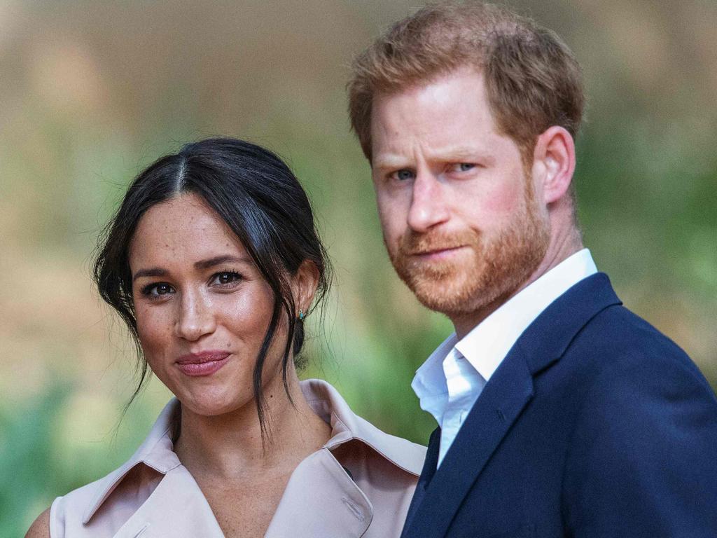 Britain's Prince Harry, Duke of Sussex (R) and Meghan, the Duchess of Sussex (L).