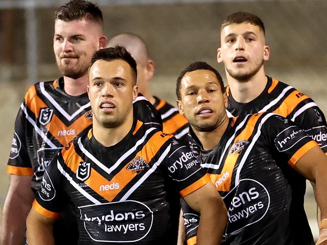 SYDNEY, AUSTRALIA - AUGUST 22: The Tigers look on dejected after a Roosters try during the round 15 NRL match between the Wests Tigers and the Sydney Roosters at Leichhardt Oval on August 22, 2020 in Sydney, Australia. (Photo by Cameron Spencer/Getty Images)