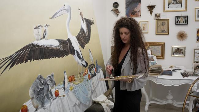 Kate Bergin is surrounded by artworks in her Noosa hinterland hideaway. Picture: Russell Shakespeare