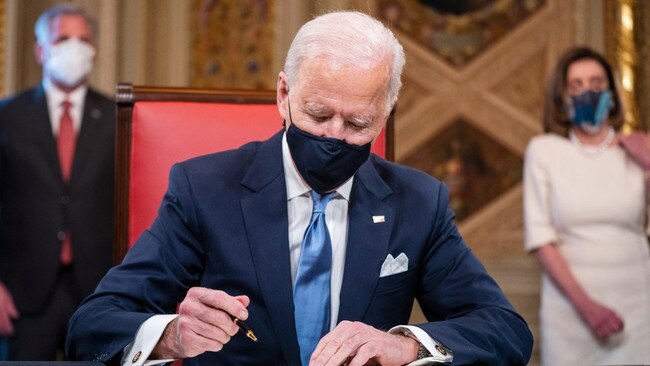 Joe Biden signing his inauguration declaration in 2021. Picture: Jim Lo Scalzo/EPA/The Times