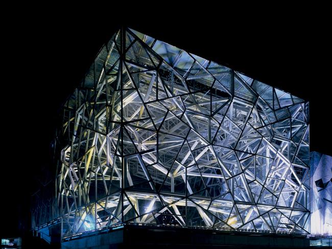 Fed Square at night, as seen from the Yarra River.