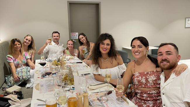 (L-R) Amy White, Emma Green, James Riordan, Emma Dinon, Sally Phlapps, Camilla Caddeo, Frankie Neild and Matt Di Cola enjoying Christmas Day at Hilton Darwin, 2022. Picture: Annabel Bowles