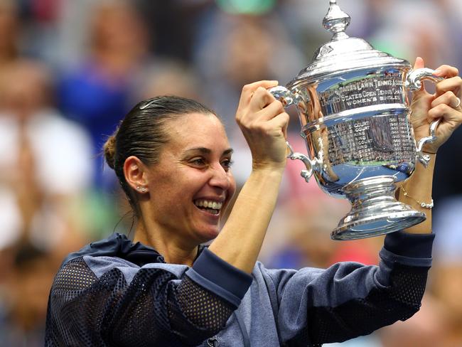 NEW YORK, NY - SEPTEMBER 12: Flavia Pennetta of Italy celebrates with the winner's trophy after defeating Roberta Vinci of Italy during their Women's Singles Final match on Day Thirteen of the 2015 US Open at the USTA Billie Jean King National Tennis Center on September 12, 2015 in the Flushing neighborhood of the Queens borough of New York City. Pennetta defeated Vinci 7-6, 6-2. (Photo by Clive Brunskill/Getty Images)