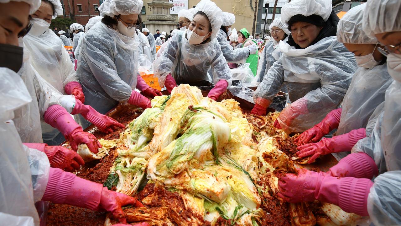 South Koreans make Kimchi to donate to the poor in preparation for a brutal winter in Seoul. Picture: Chung Sung-Jun/Getty Images