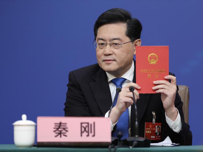 BEIJING, CHINA - MARCH 07: China's foreign minister Qin Gang  holds a China's constitution during a press conference at Media Center on March 07, 2023 in Beijing, China. Foreign Minister Qin Gang answered questions from Chinese and foreign journalists on China's foreign policy and foreign relations. (Photo by Lintao Zhang/Getty Images)