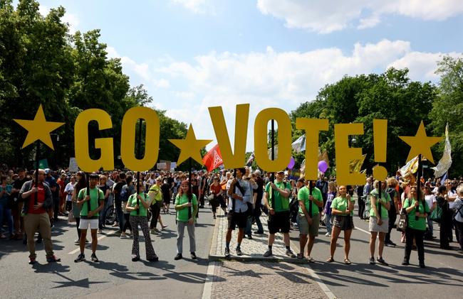 Tens of thousands of demonstrators rallied in cities across Germany Saturday, urging a vote against the far-right