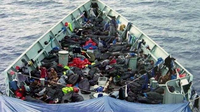 Asylum seekers aboard HMAS Adelaide after being rescued from a sinking boat in 2001.