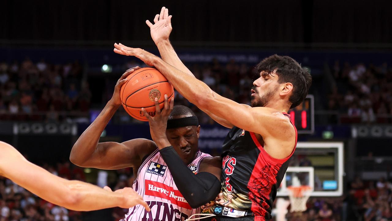 Kouat Noi of the Kings drives into William Hickey of the Hawks in Sydney. Picture: Mark Kolbe/Getty Images.