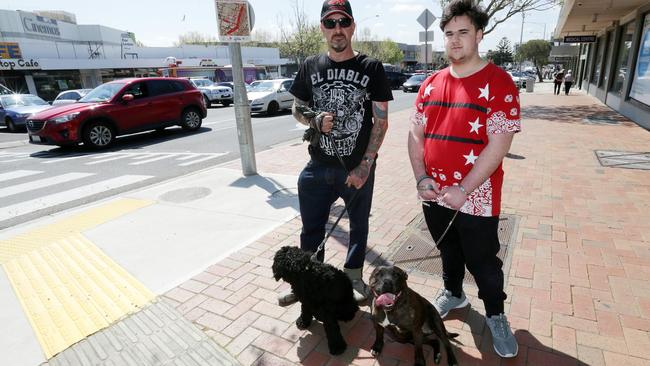 Dog owners Dave Toffolon and son Lorenzo walk through the banned streets of Frankston with dogs Fonzie and Zelda. Picture: Norm Oorloff